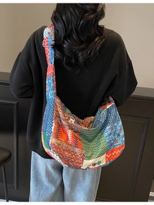Colorful patchwork canvas crossbody bag with ethnic patterns and adjustable strap