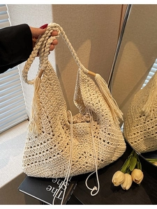 Handmade crochet beach shoulder bag in cream white with fringe and drawstring liner