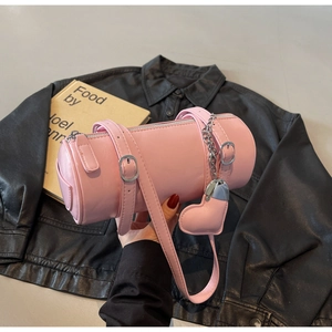 Pink oil-wax leather cylindrical bag with heart charm and silver chain strap details