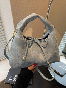 Light blue Hobo handbag with bow decoration and stylish crescent moon shape for women