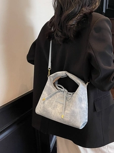 Stylish light blue washed texture dumpling bag with golden JAMXOO hardware and strap