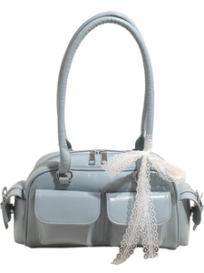 Light blue faux leather Boston handbag with front pockets and elegant lace ribbon detail
