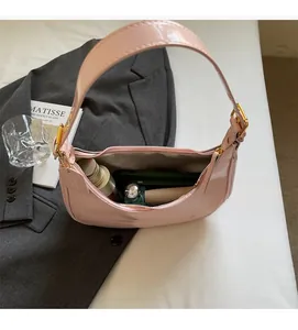 Detail view of pink patent leather moon bag interior showing large capacity for essentials