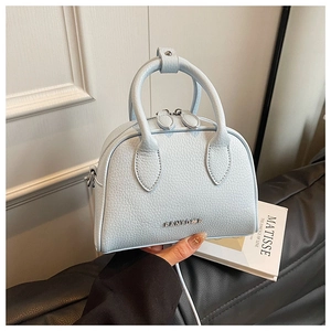 Detail of light blue lychee pattern leather bowling bag with metallic PANTOOR logo
