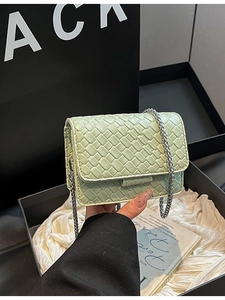 Mini mint green woven chain crossbody bag in a premium luxury gift box display