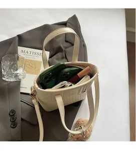 Top view of cream woven bucket bag interior showing spacious room for phone and makeup