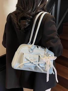Pale blue glossy patent leather shoulder bag with decorative bow and pearl charm