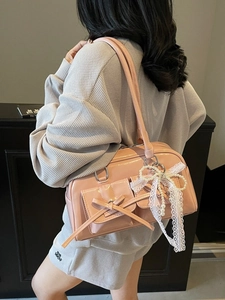 Pink patent leather shoulder bag with lace bow and pearl pendant for women