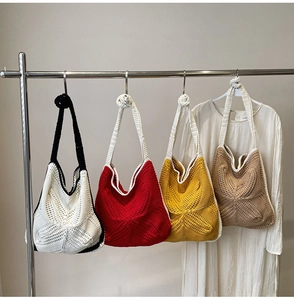 Detail of hollow crochet shoulder bags in white, red, yellow and khaki colors