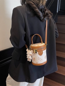 Cylinder shoulder bag in cream and brown with Teddy Bear print and plush charm