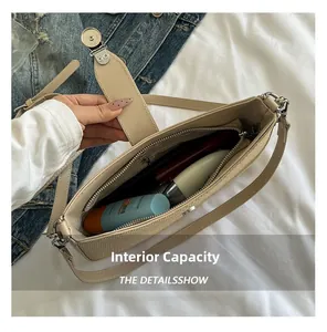 Detail showing internal capacity of the woven bag with zipper pocket and cosmetics