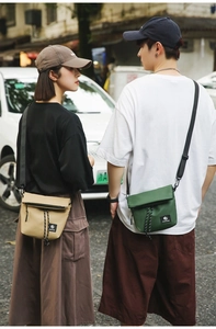 Outdoor shot of khaki and green water-resistant nylon messenger bags on models