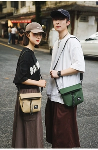 Street style shot of khaki and green nylon crossbody bags shown by couple models