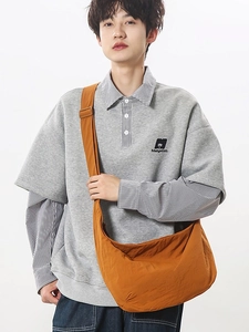 Japanese style orange nylon crescent crossbody bag with minimalist casual sporty outfit