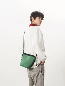 Green checkered drawstring bucket bag with adjustable strap for outdoor sports and casual wear