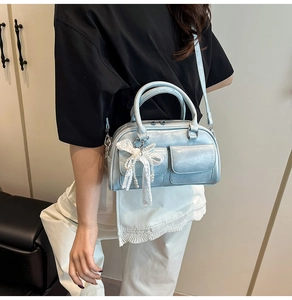 Light blue metallic bowling bag with dual handles and lace pearl bow charm detail