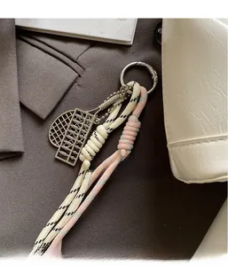 Detailed macro view of creative mini metal abacus pendant with thick woven rope charm