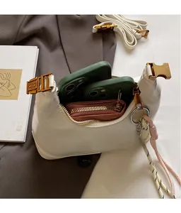 Interior view showing large capacity for two smartphones and a wallet in white hobo bag
