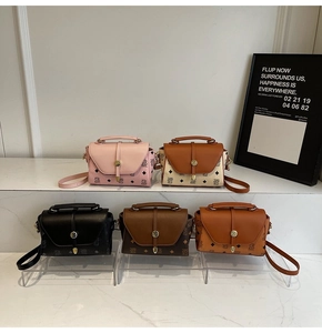 Collection of mini crossbody bags in assorted vintage prints with metal twist locks