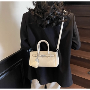 Chic cream mini satchel with lychee pattern leather and heart charm detail