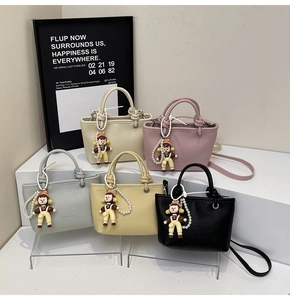 Detailed macro view of high-quality lychee grain leather mini bucket bags in five colors