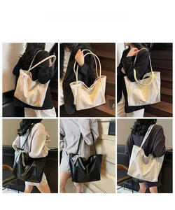 Detail showing soft leather tote bag with lace bow decoration in beige and black colors