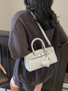 Mini grey litchi grain leather handbag with heart charm and crossbody strap