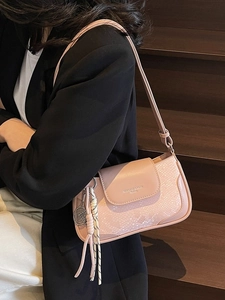 Pink faux leather square underarm bag with tennis racket charm and shoulder strap