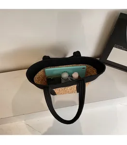 Top view of a spacious straw tote bag showing internal capacity for daily essentials