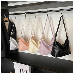 Row of woven shoulder bags in five colors on a rack featuring high-quality PU craftsmanship