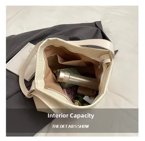 Interior view of large capacity cream tote bag with zip closure and spacious pockets