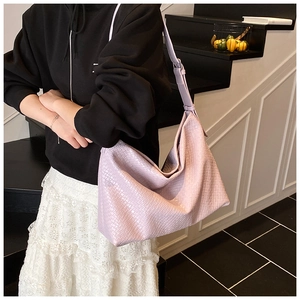 Detail of light purple woven texture and adjustable strap on large hobo shoulder bag