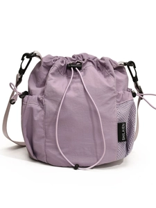 Light purple nylon drawstring bucket bag with mesh side pockets and adjustable strap