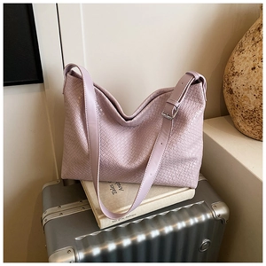 Close-up of woven texture and silver buckle on lavender large capacity tote bag