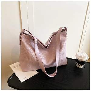 Detailed close-up of light purple woven texture on the large PU leather tote bag