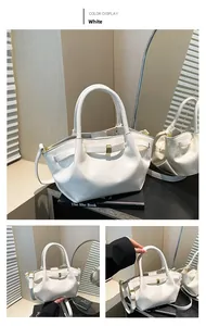 Detailed view of a white waxed leather bucket bag with elegant pleats and gold metal clasp