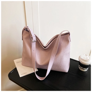 Close-up of the purple woven texture and adjustable strap buckle on this large tote bag