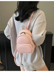 Pink lychee leather mini backpack for women with adjustable straps and front pocket