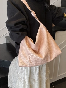 Large capacity woven leather hobo bag for women worn over shoulder in pink