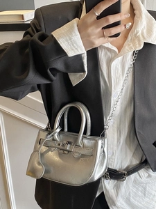 Silver metallic mini crossbody shell bag with heart charm and chain strap for women