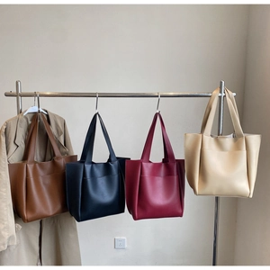 Set of minimalist leather tote bags in brown, black, burgundy, and beige colors