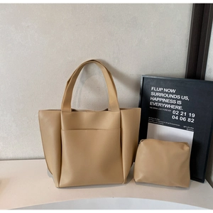 Detail of khaki tote bag set with matching inner pouch and elegant matte faux leather texture