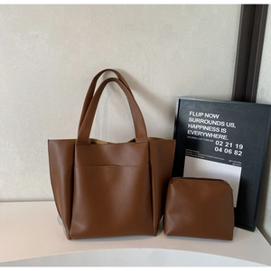 Deep brown leather tote set with large bucket bag and matching small square zipper pouch