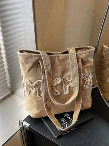 Vintage washed denim tote bag with oversized letter embroidery and long shoulder strap
