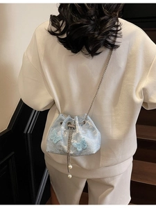 Elegant light blue lace bucket bag with 3D butterfly decor and pearl chain strap