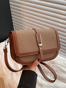 Retro straw crossbody bag with brown leather trim and metal clasp for women