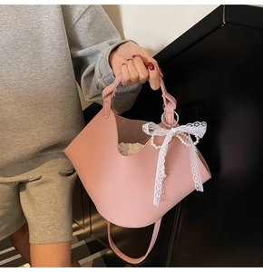 Pink lychee texture bucket bag with lace pearl bow charm and drawstring interior