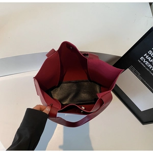 Top view of deep red tote bag showing magnetic closure and spacious interior compartment