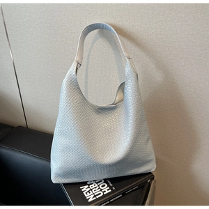 Detail of light blue woven texture on large hobo tote bag for daily commute