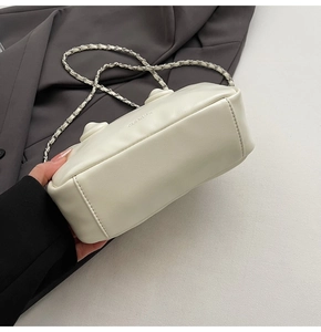 Detailed macro view of cream-colored PU leather texture and CLEAR-K logo embossing